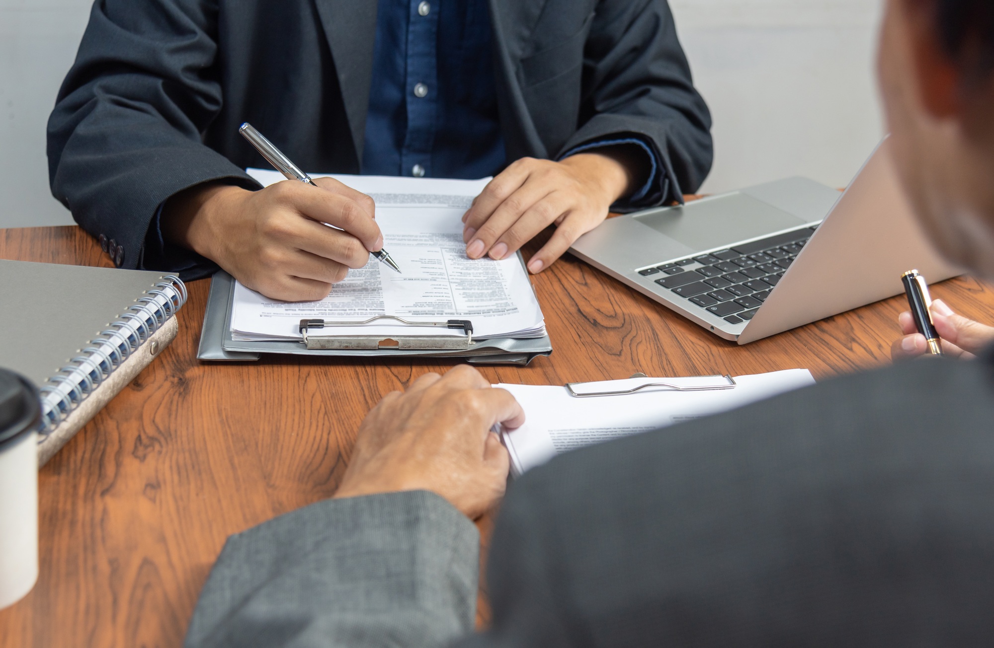 Manager or human resources is interviewing for employee job and resume application at office.
